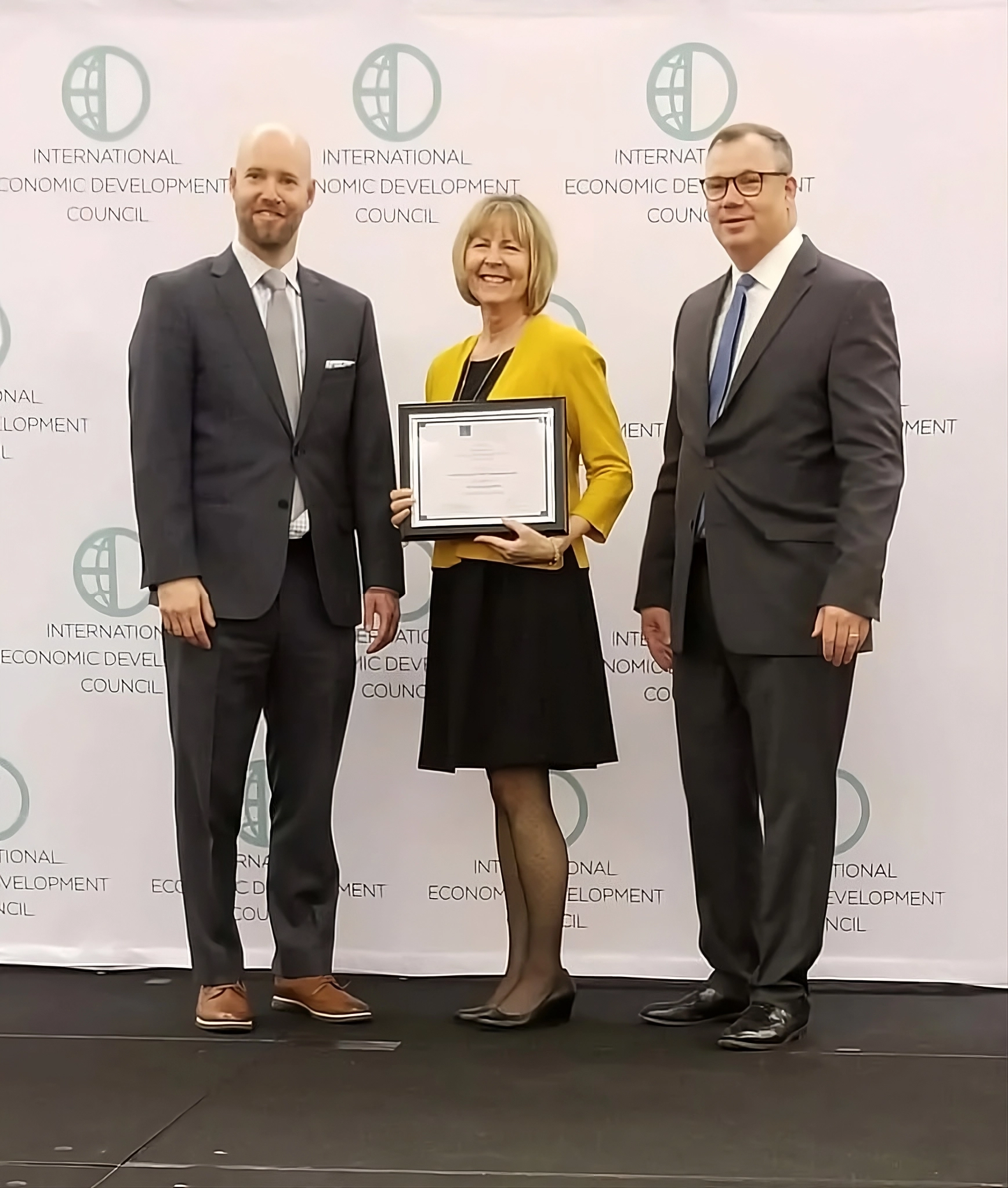 About 55 SourceLink team accepting the 2019 IEDC Silver Excellence award in Indianapolis